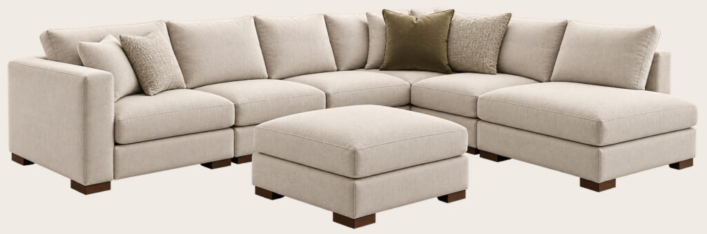 Customizable sectional sofa with chaise and ottoman in a completed configuration